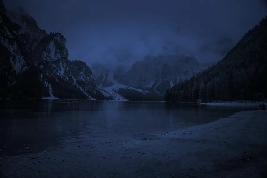 A landscape graded from day to night