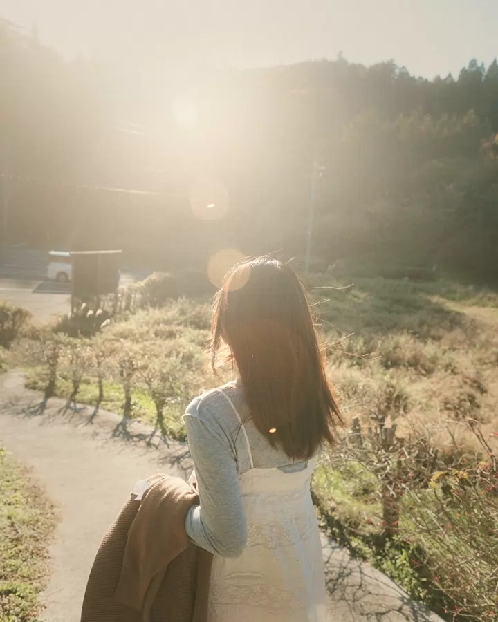 An iPhone-style portrait with a warm film look